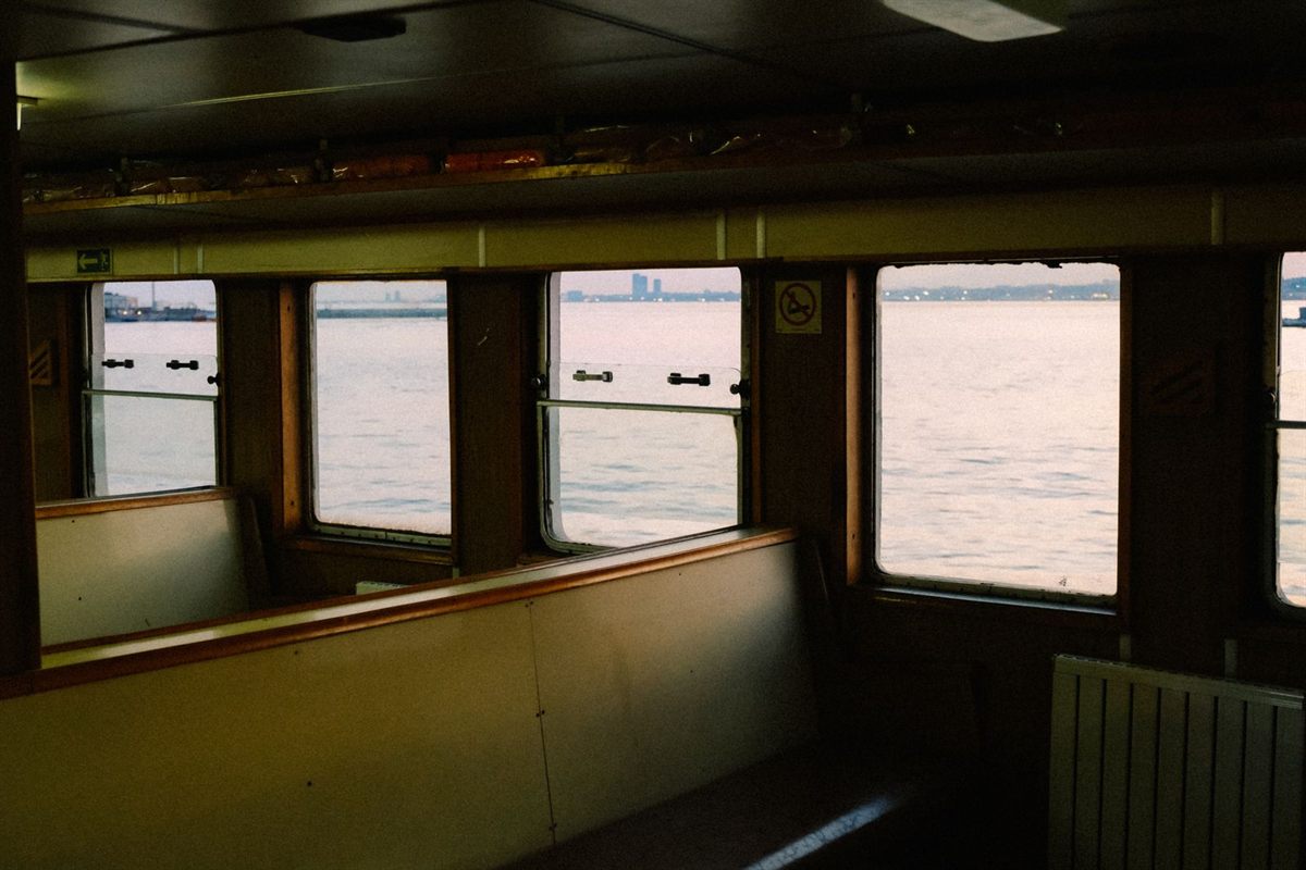 The sea seen through the windows of a ship&rsquo;s indoor lounge